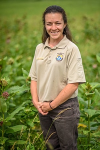 FWS staffer stands in milkweeds-3