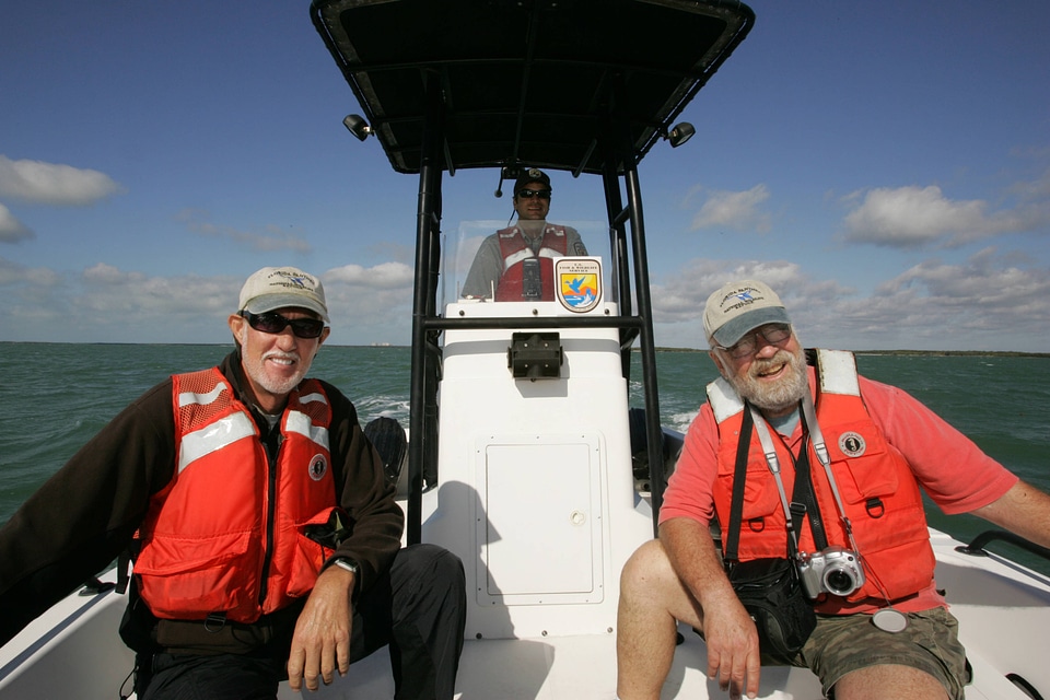 Refuge staff in Service boat