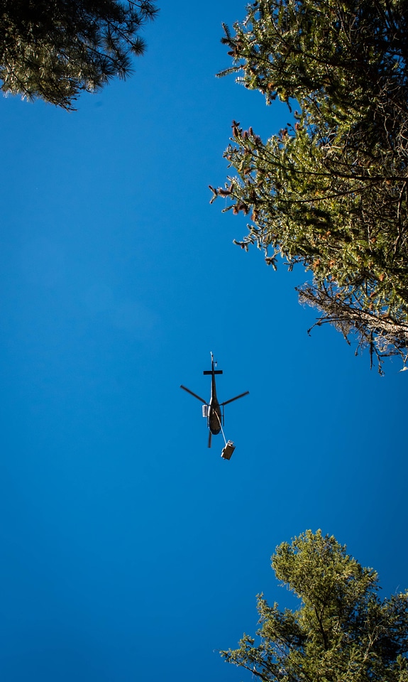 Fish tank being lifted by helicopter-2