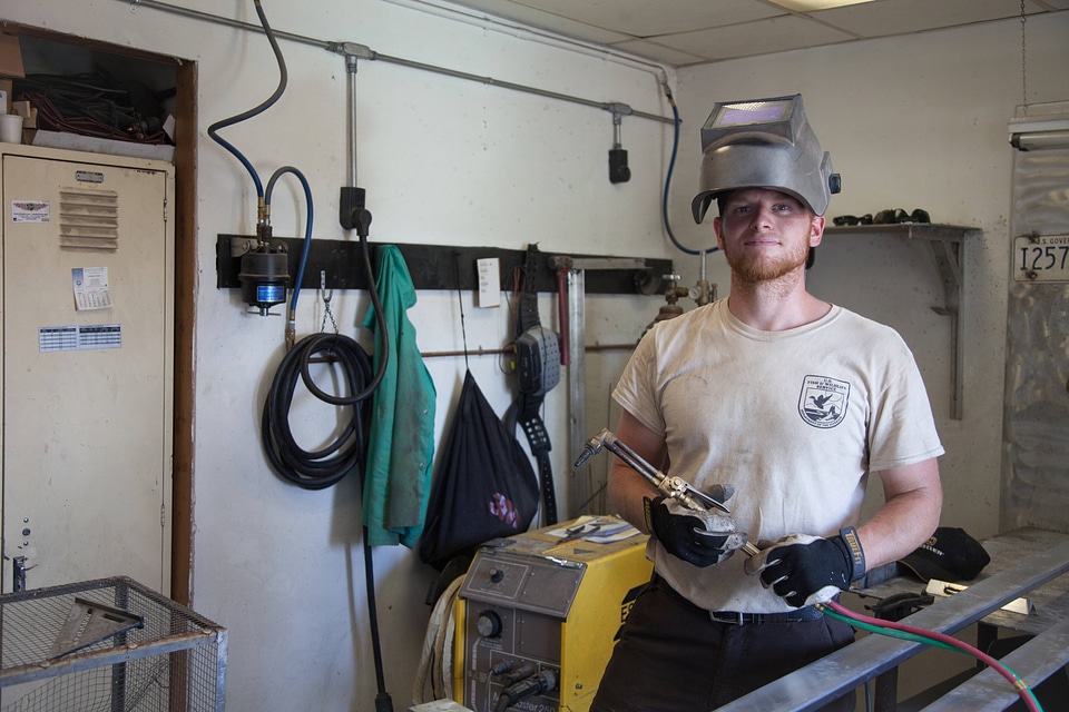 Maintenance worker with torch-5
