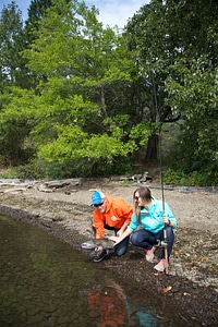 Young couple releases a Fall Salmon-1 photo