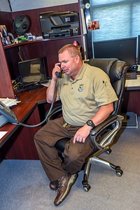 FWS Staffer talks on telephone-1