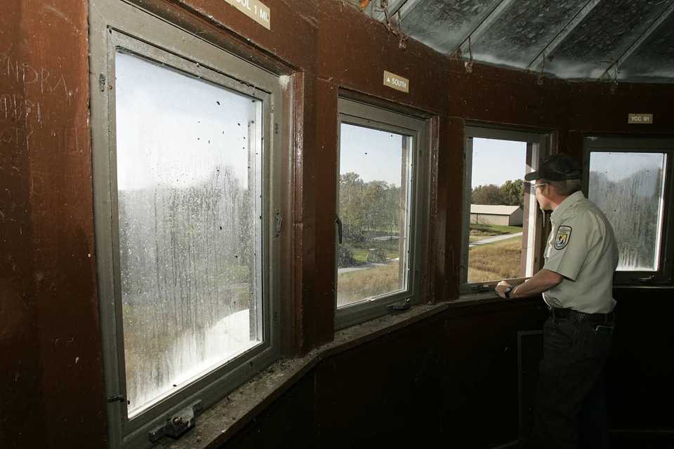Service personnel inside of an observation tower