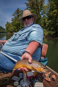 Man holding a brown trout-1