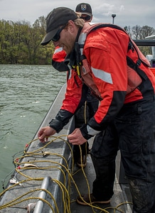 USFWS Fisheries crew baiting lines for lake sturgeon-1