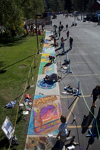 Chalk artists display their sidewalk art photo