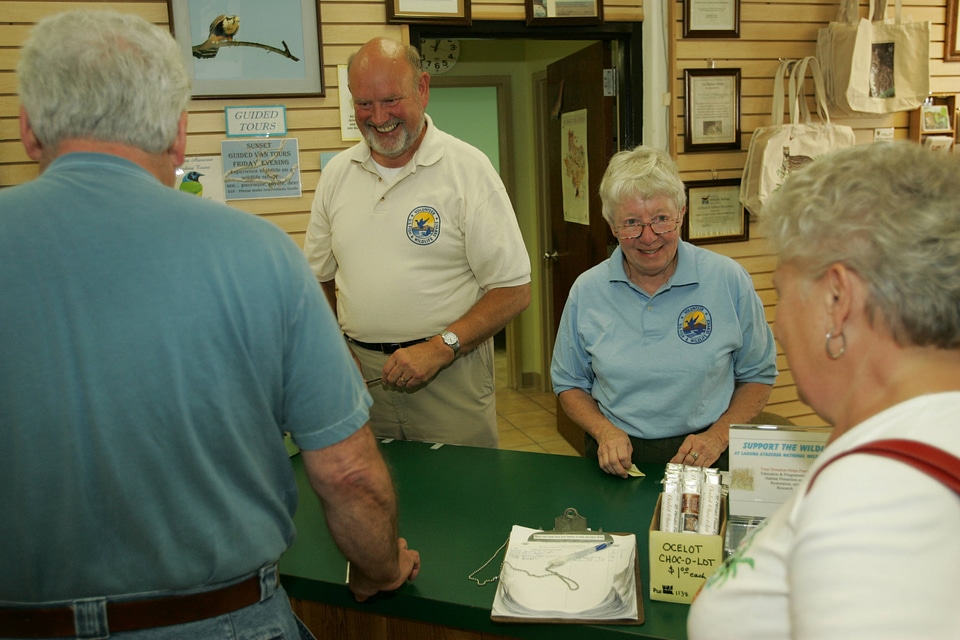 Volunteers help visitors