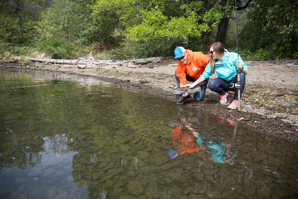 Young couple releases a Fall Salmon-1