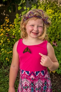 Monarch on little girl's dress