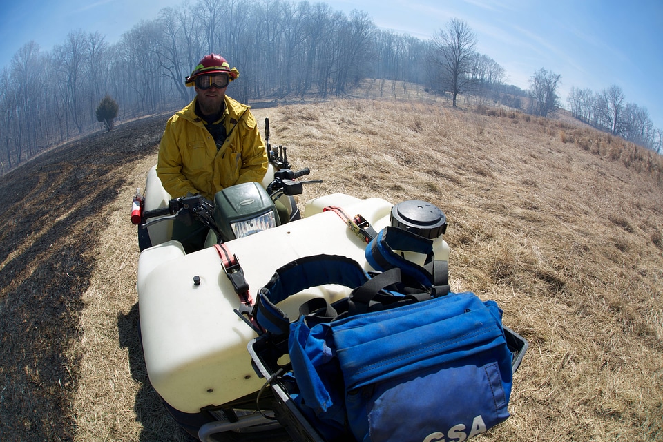 Service employee monitoring prescribed burn-7