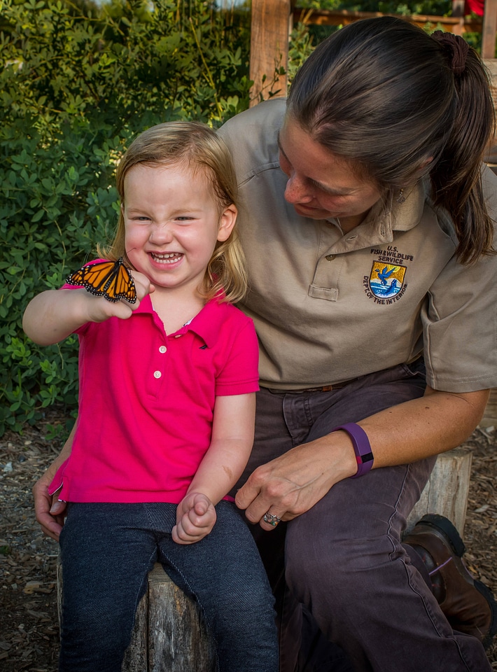 Monarch on hand of little girl-1