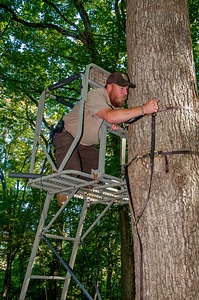 NCTC land management specialist inspecting deer stand for safety-3 photo