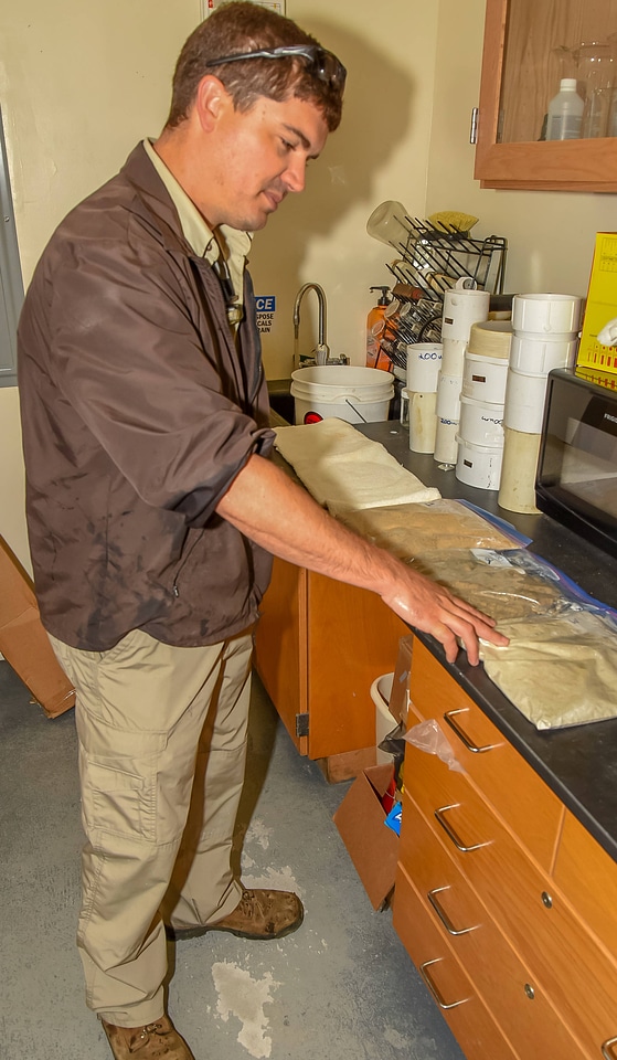 FWS mussel biologist, Jonathan Wardell , examines equipment-1