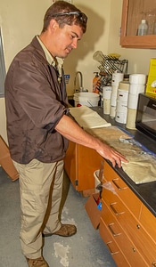 FWS mussel biologist, Jonathan Wardell , examines equipment-1
