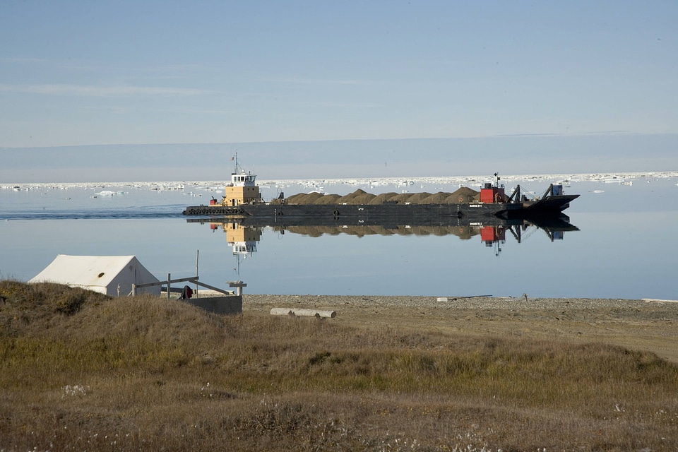 Barge navigates through melting ice