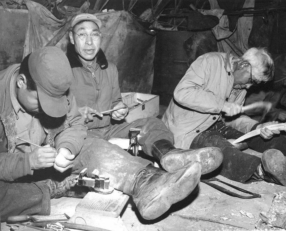 King Island Eskimos carving ivory near Nome