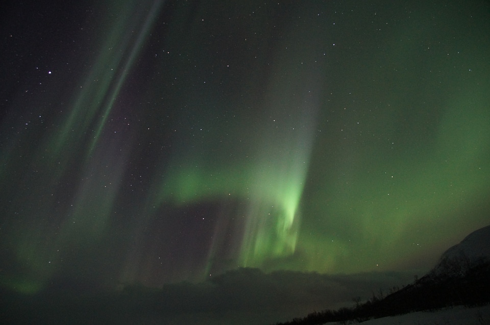 Aurora borealis starry sky solar wind