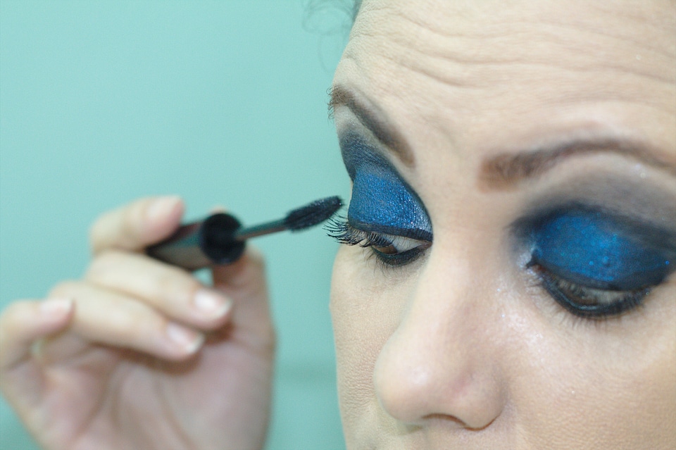 Makeup woman applying make up shadows