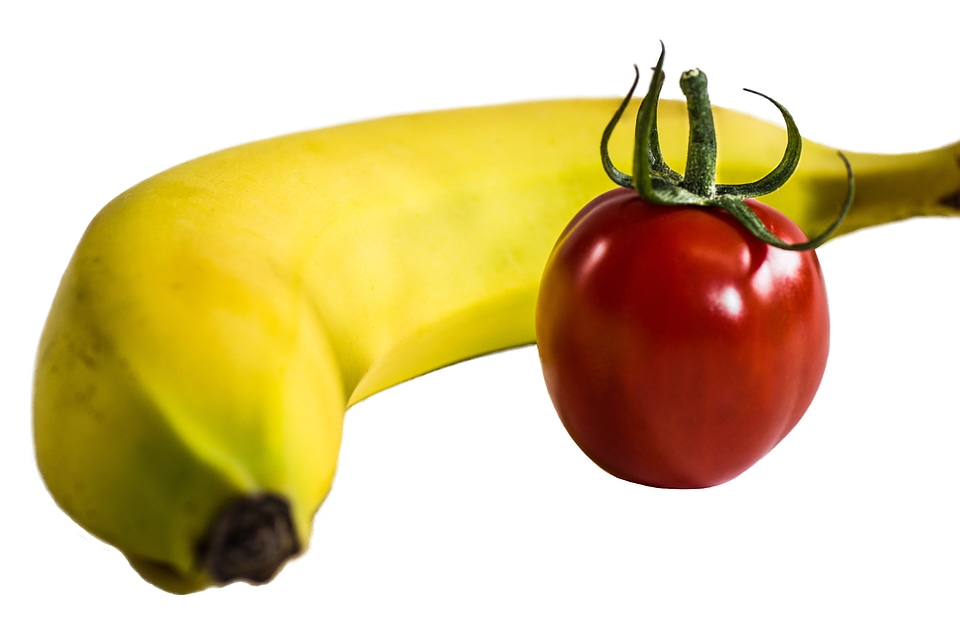 Isolated bananas tomatoes