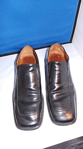 Foot black shoe photo