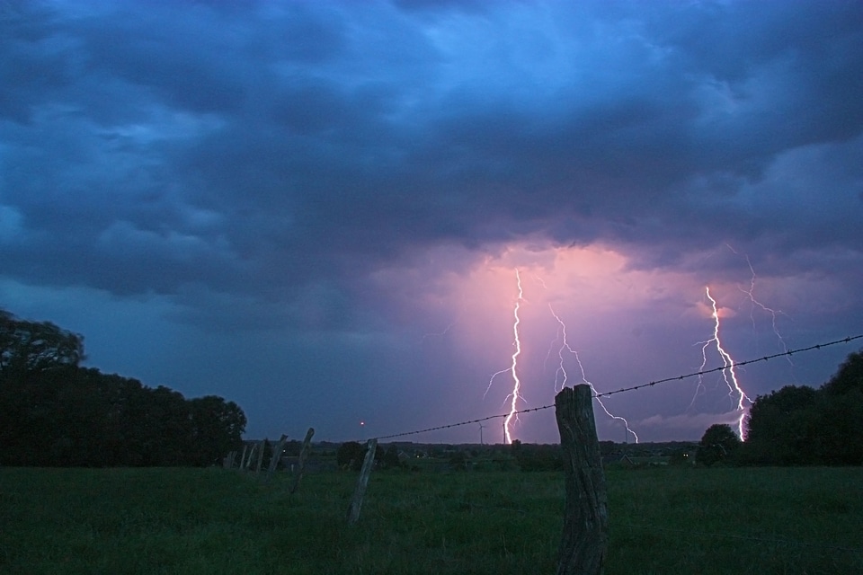 Twilight storm pasture fence