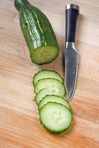 Cucumber slices wooden chopping board chopping board photo