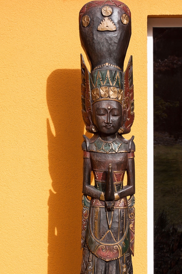 Painted carved wood carving