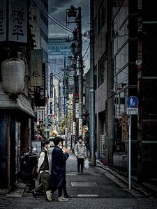 Young Japanese Men Walking, Taito, Tokyo, Japan photo