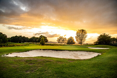 Golf course at sunset photo