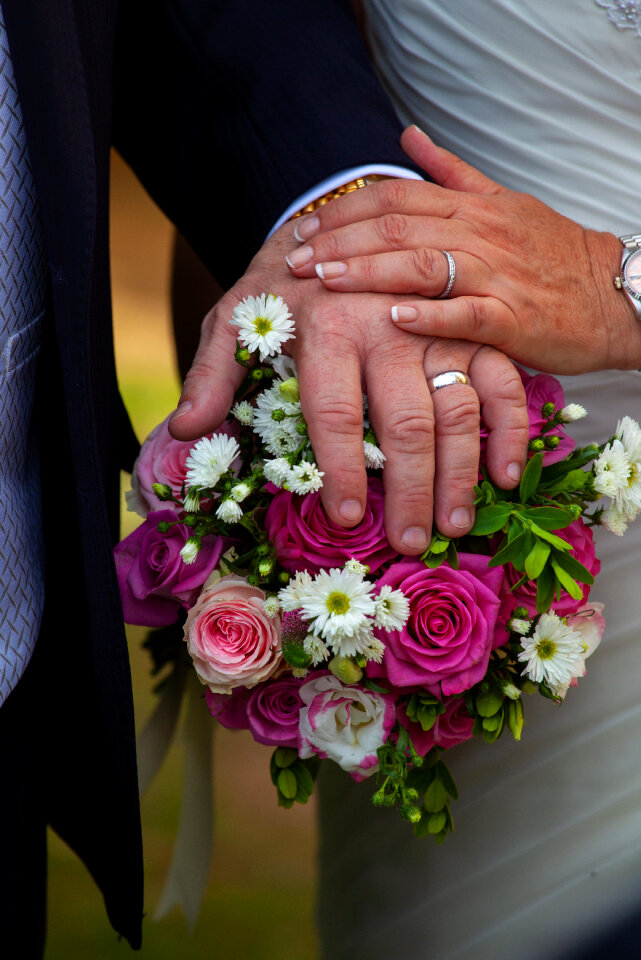 hands showing wedding rings