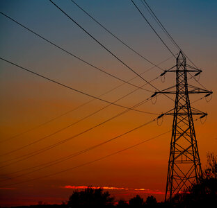 Electricity pylon against a spring sunset photo