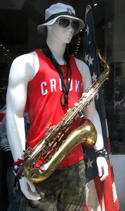 hunky guy with saxophone photo