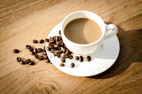 Cup of coffee with beans photo