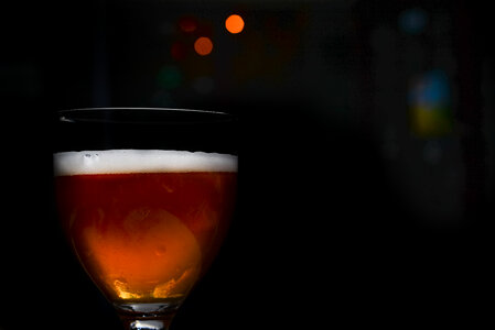Glass of beer in the dark photo