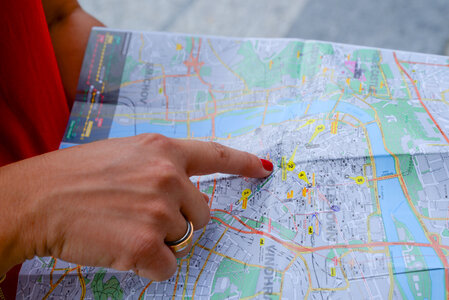 Woman pointing on a map photo