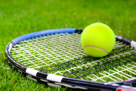 Tennis racket with ball photo