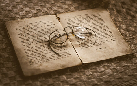 Antique glasses and book photo