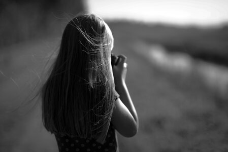 Girl taking picture in black and white photo