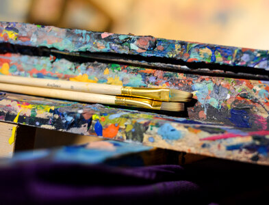 Paint brushes on an easel photo
