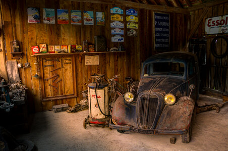 Old car in repair shop photo