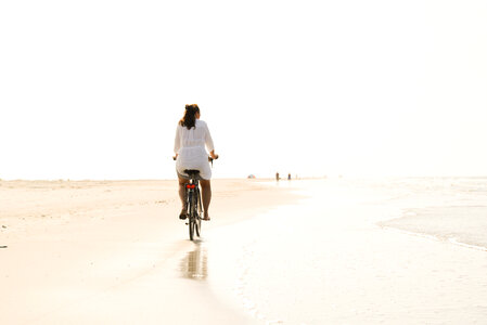 Riding a bike on the beach photo
