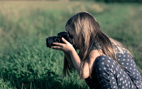 Girl taking a photo photo