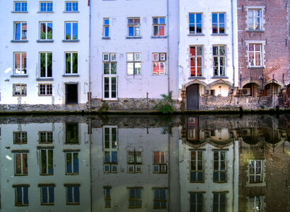 Houses reflected in water photo