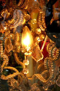chandelier closeup with candle-flame bulb photo