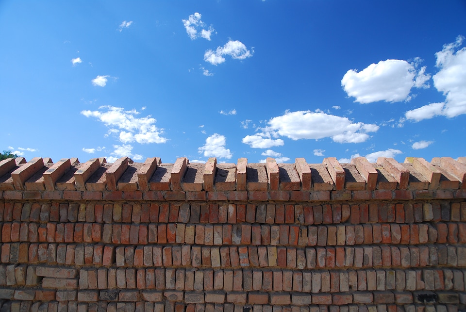 Brick wall cloud blue sky