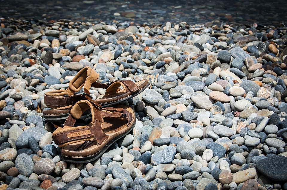 Shoes beach the stones