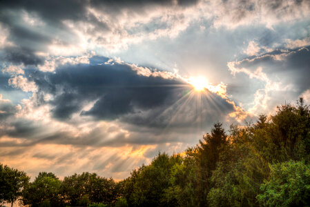 Sun behind the clouds photo
