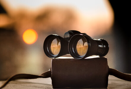 Binoculars and sunset photo