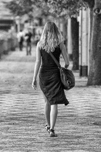 Beautiful woman walking on the street photo