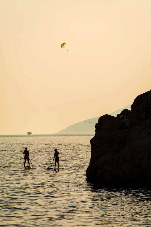 Silhouette of Two People on Paddleboards